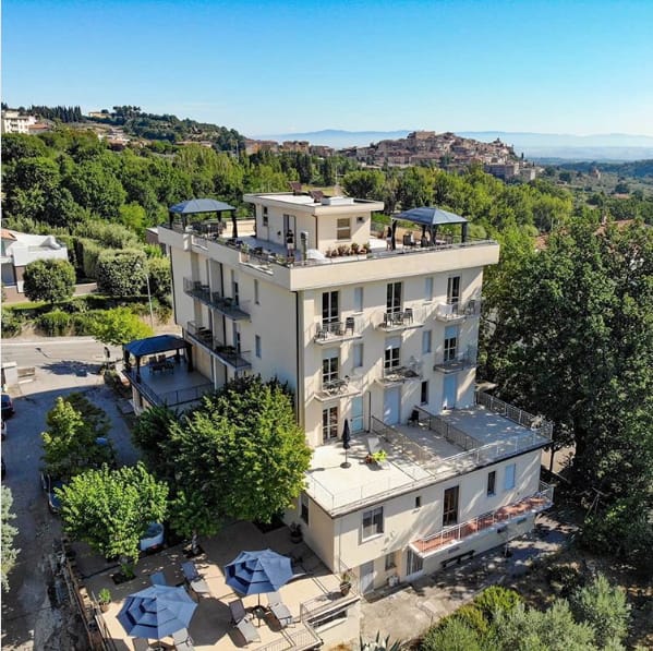 Chianciano Terme from the air, the old town on its hill beyond.