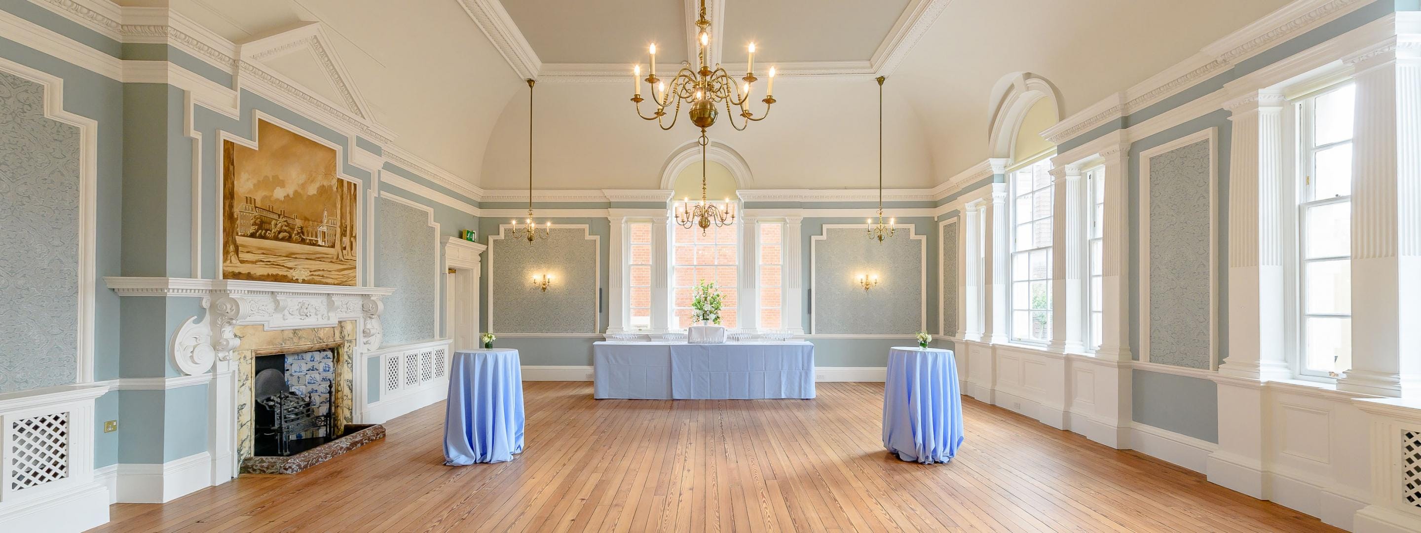 The Cadogan Suite: pale panelled walls and a single chandelier.